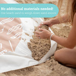 Beach Puddle waterproof carrying bag with mesh sides holding the folded blanket.