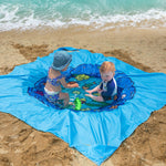 RunNico two in one beach blanket unfolded to full size on an outdoor summer family vacation.