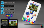 A lifestyle view of the compact vertical video game unit being held comfortably for on-the-go travel entertainment.
