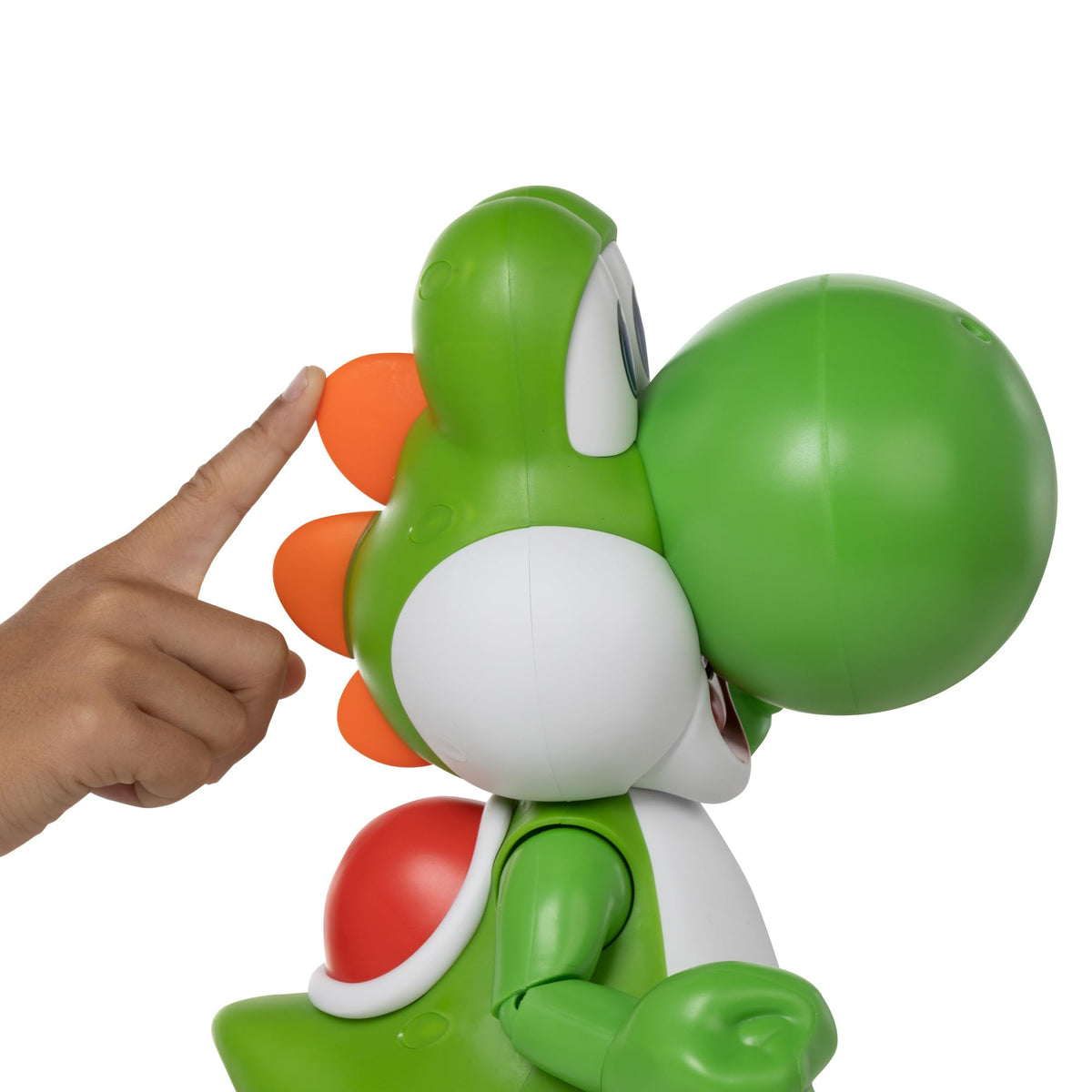 Yoshi interactive toy being lifted to demonstrate the built-in motion activated sound effects.