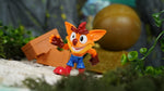 Crash Bandicoot figurine with boulder and crate