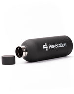 PlayStation merchandise travel mug in a lifestyle setting