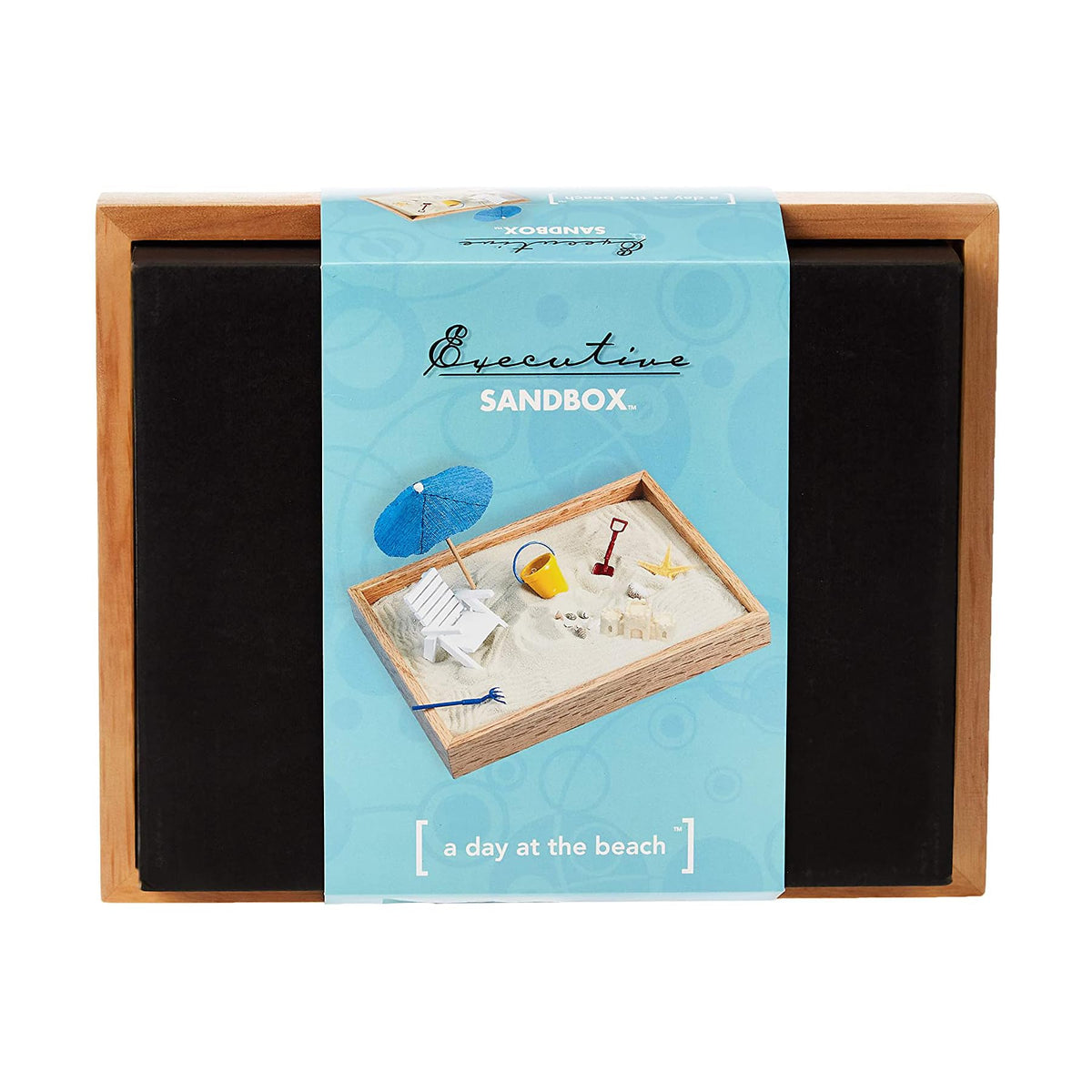 Miniature lounge chair and umbrella in Executive Sandbox