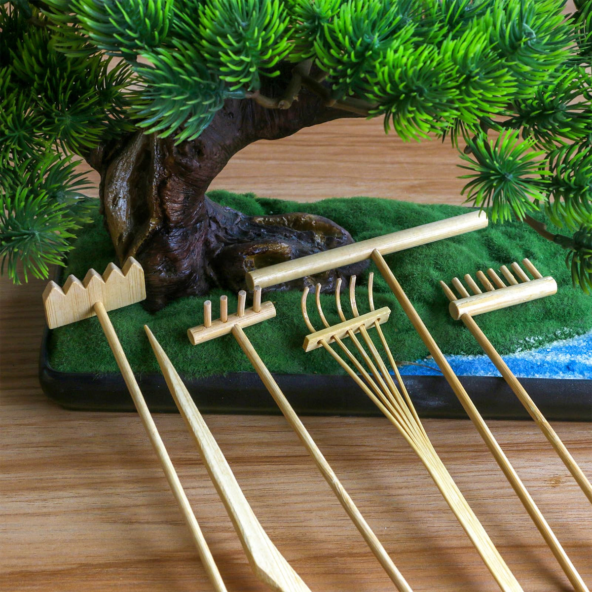 Bamboo rake holder with various rake tools organized