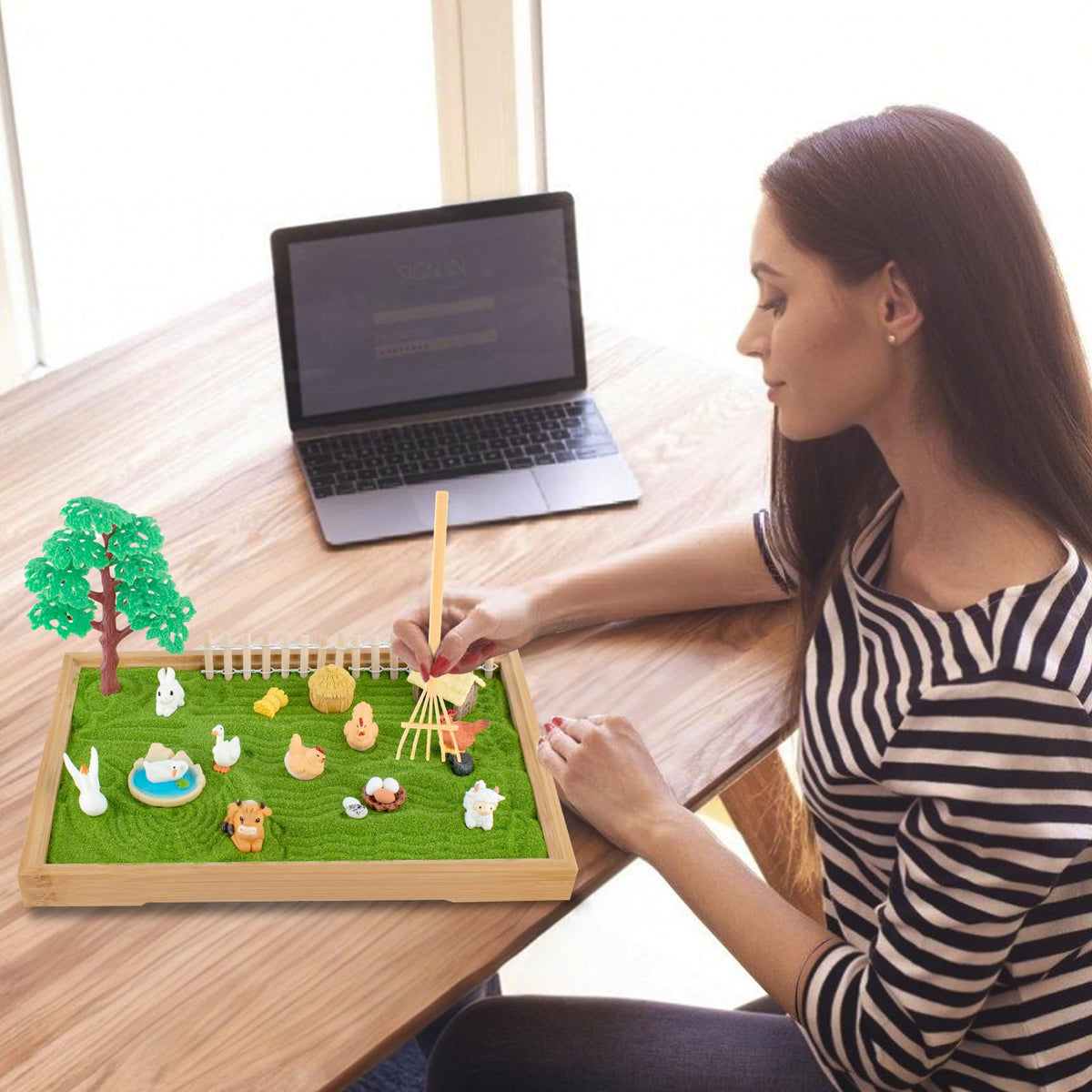 Detailed view of bamboo rakes and sand patterns in Yssppoy Zen garden
