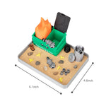 Close up of raccoon figurines in Stylor Dumpster Fire Zen Garden