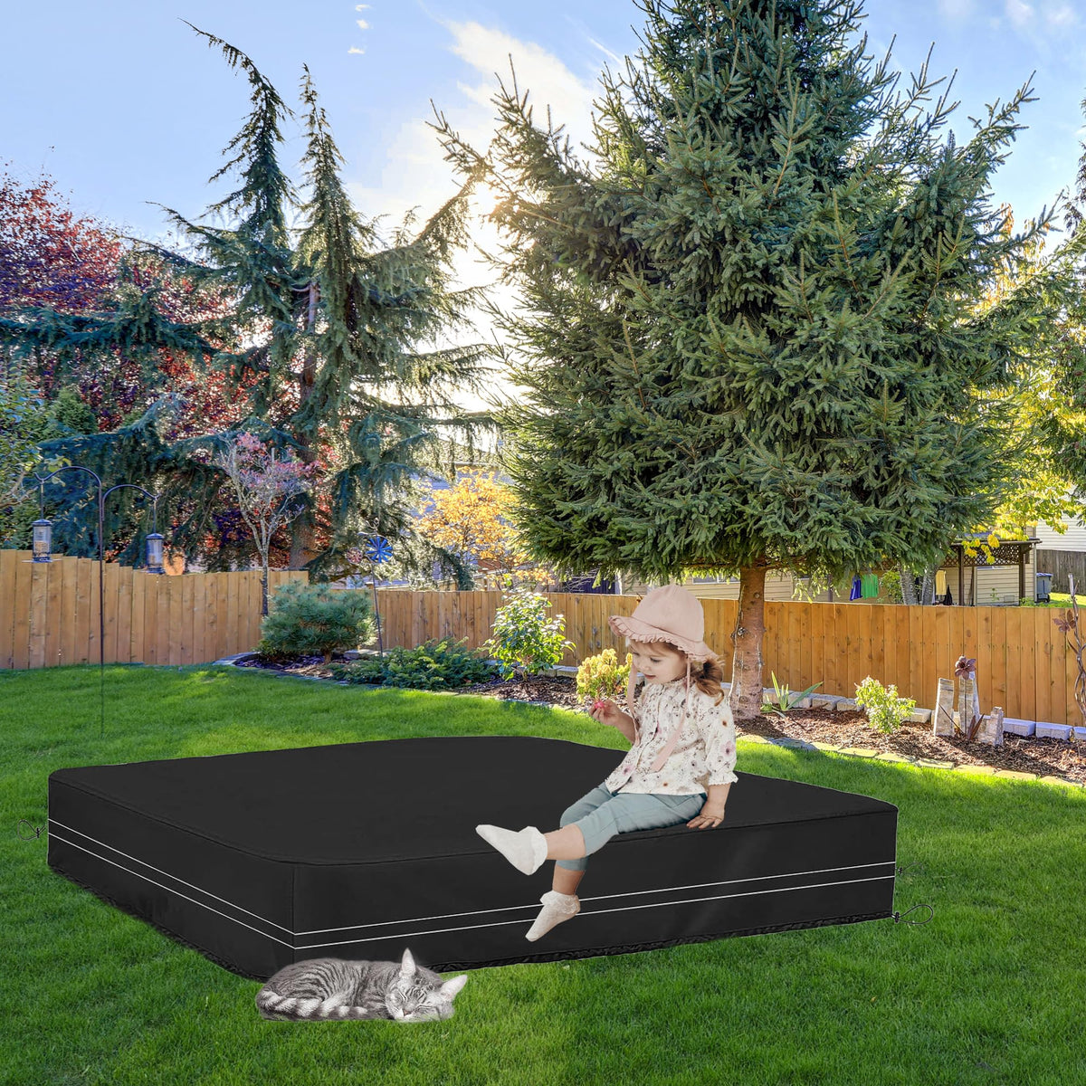 Child playing in clean sandbox with cover removed
