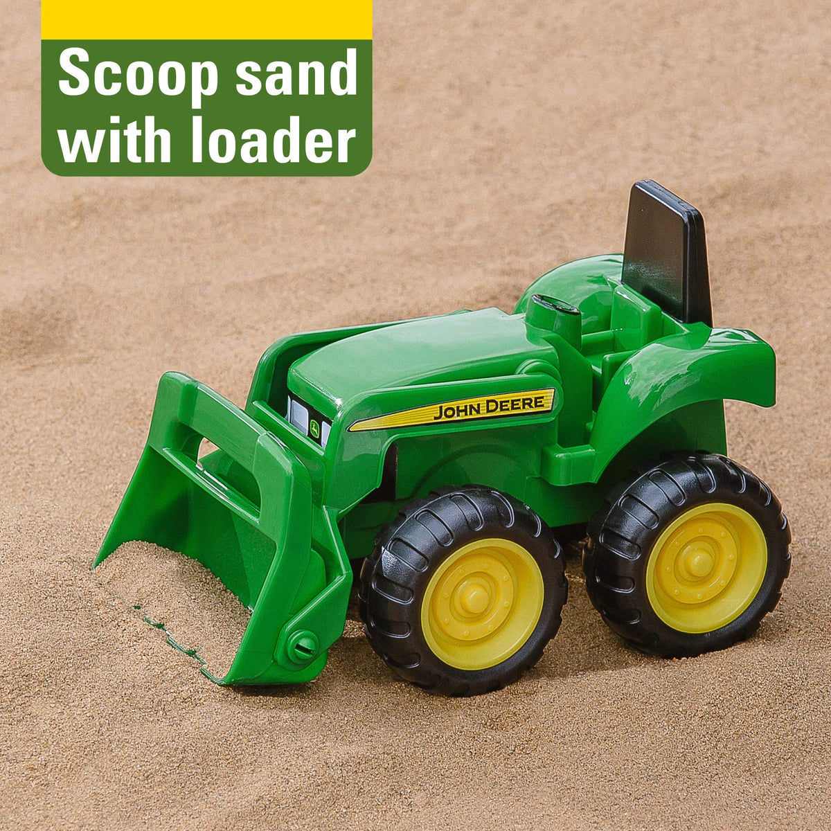 Close up of functional front loader on John Deere toy tractor