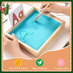 Child using finger to trace letters in the Moriteck sand tray