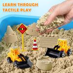 Children playing with construction trucks and sand mold tools
