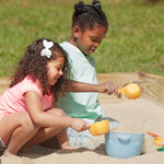 Child playing with Melissa and Doug seaside sidekicks set at the beach