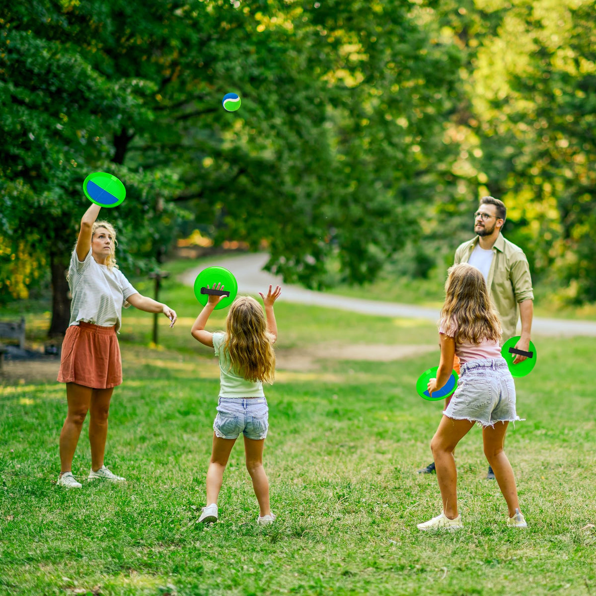 Children playing with PlayZap toss and catch paddles outdoors