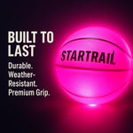 Basketball enthusiast playing with Tomleon glowing ball at dusk