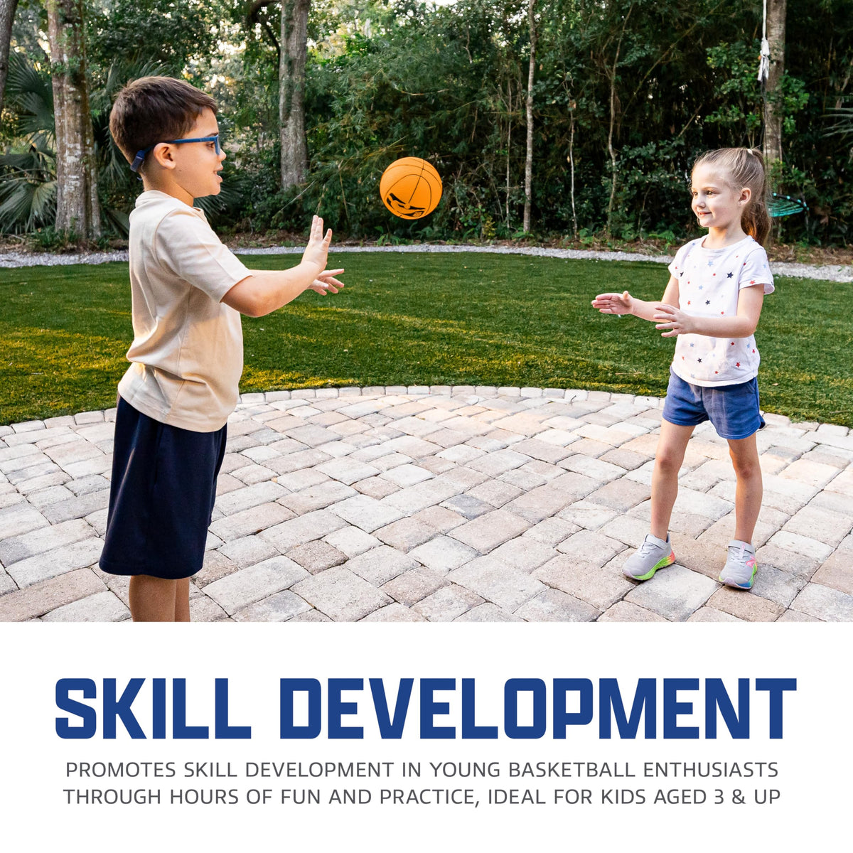 Child hands holding 5 inch Franklin Sports mini basketball