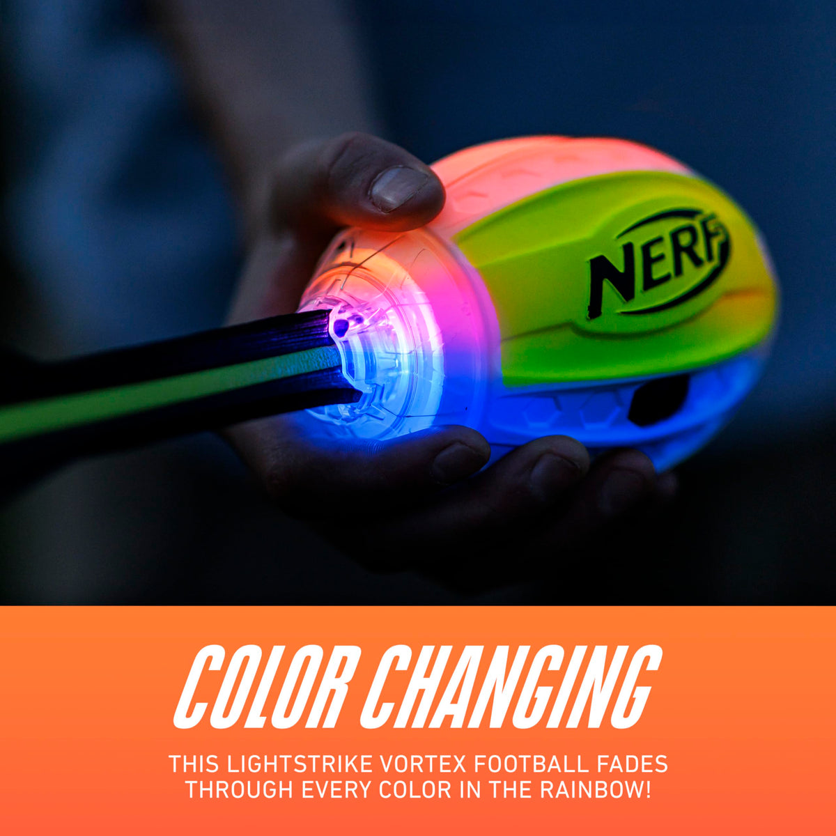 Color changing LED soft vortex football illuminating in bright rainbow colors.