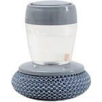 XIYOUI soap dispensing dish brush front view showing grey reservoir top and steel wool mesh scrubber.