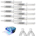 White Teeth Global forty-four percent carbamide peroxide teeth whitening kit front view showing syringes and accelerator light