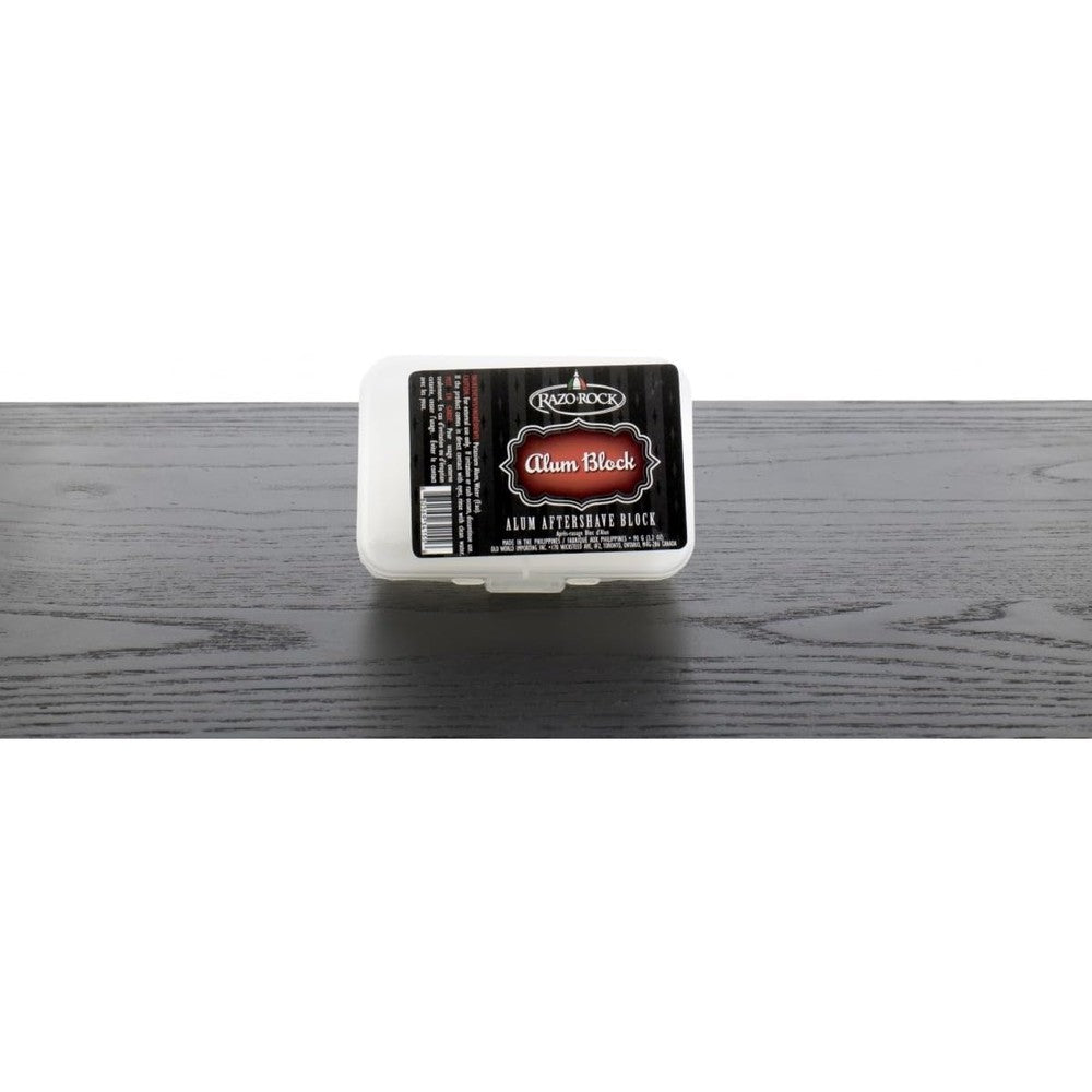 RazoRock Alum Block inside its clear protective plastic travel case front view