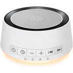 SoundMe White Noise Machine front view with warm yellow night light glow.