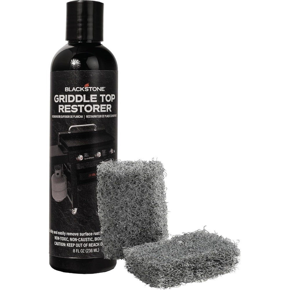Blackstone 4165 Griddle Top Restoration Kit front view showing the liquid bottle and two scrub pads for rust removal.