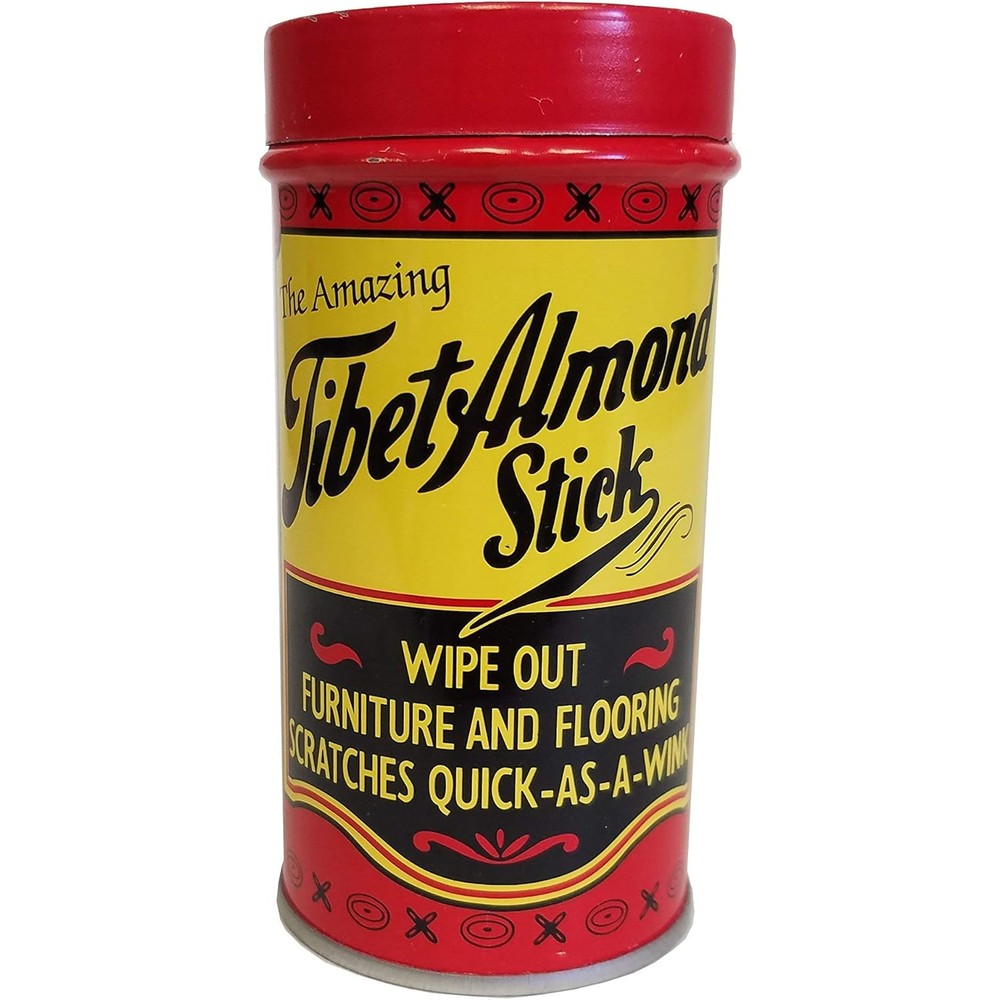 Tibet Almond Stick wood scratch remover in protective tin for furniture restoration.