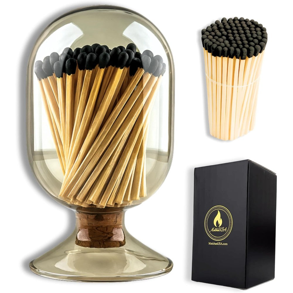 Winecraft smoke gray glass matches cloche front view showing grey tinted glass jar on a decorative table.