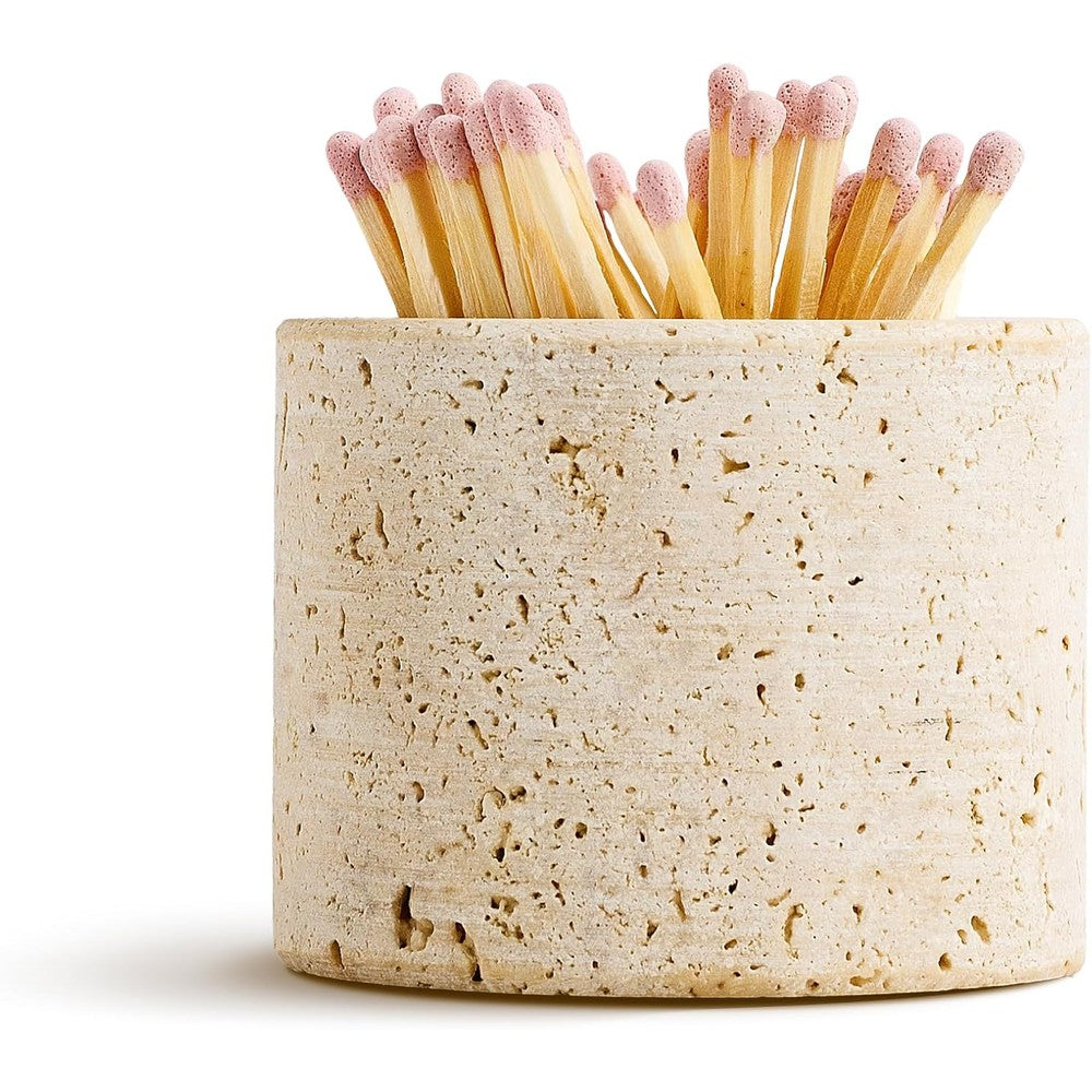 WORHE travertine stone match holder front view on a modern living room fireplace mantel