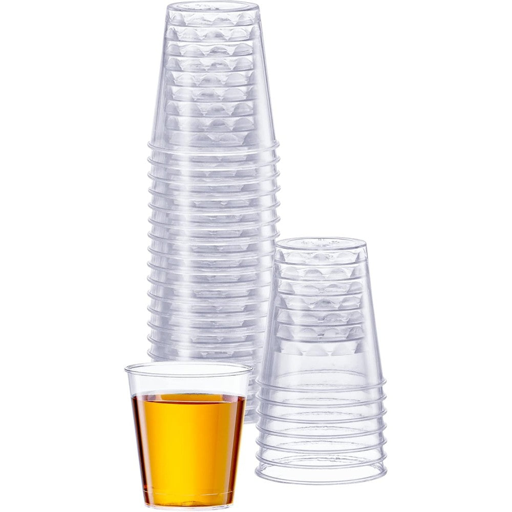 SETUP One Ounce Clear Plastic Shot Cups front view of stacked disposable glasses.