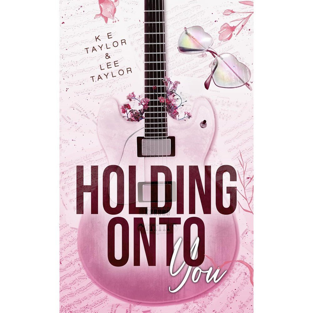 K E Taylor Holding Onto You Burnt Ashes Series Book Two front cover featuring pink aesthetic with a guitar and sunglasses.