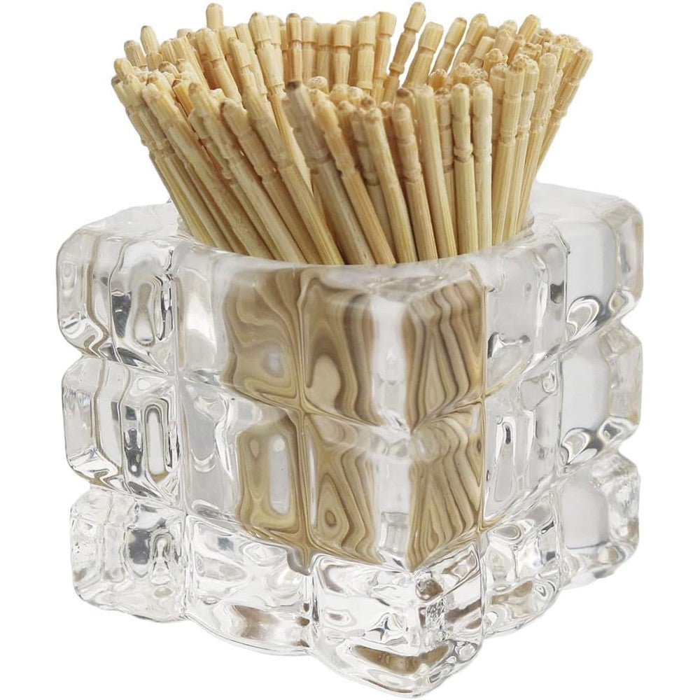 HillSpring decorative glass toothpick holder front view displaying textured cube design filled with bamboo toothpicks on a dining table.