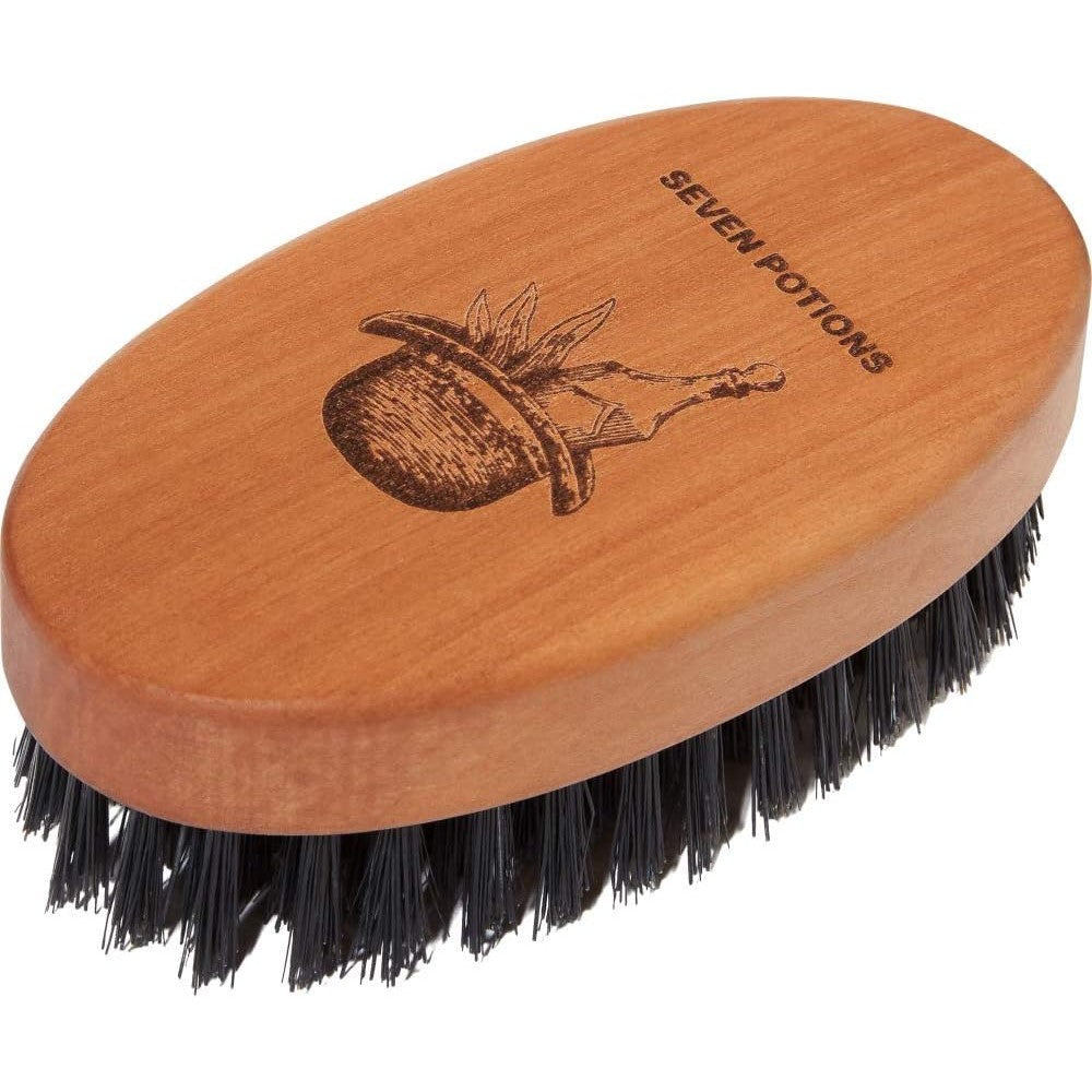 Seven Potions beard brush front view showing oval pear wood handle and natural boar bristles