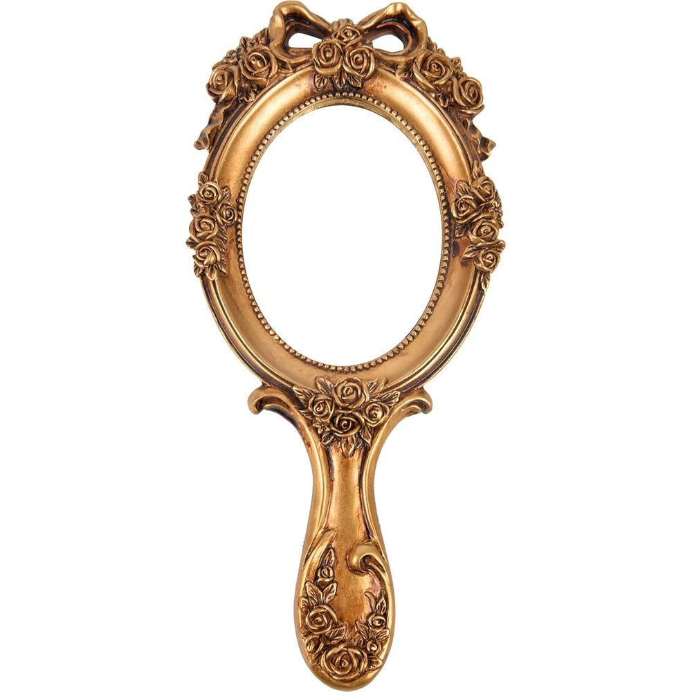 Nerien vintage handheld mirror front view displaying the clear oval vanity glass surface.