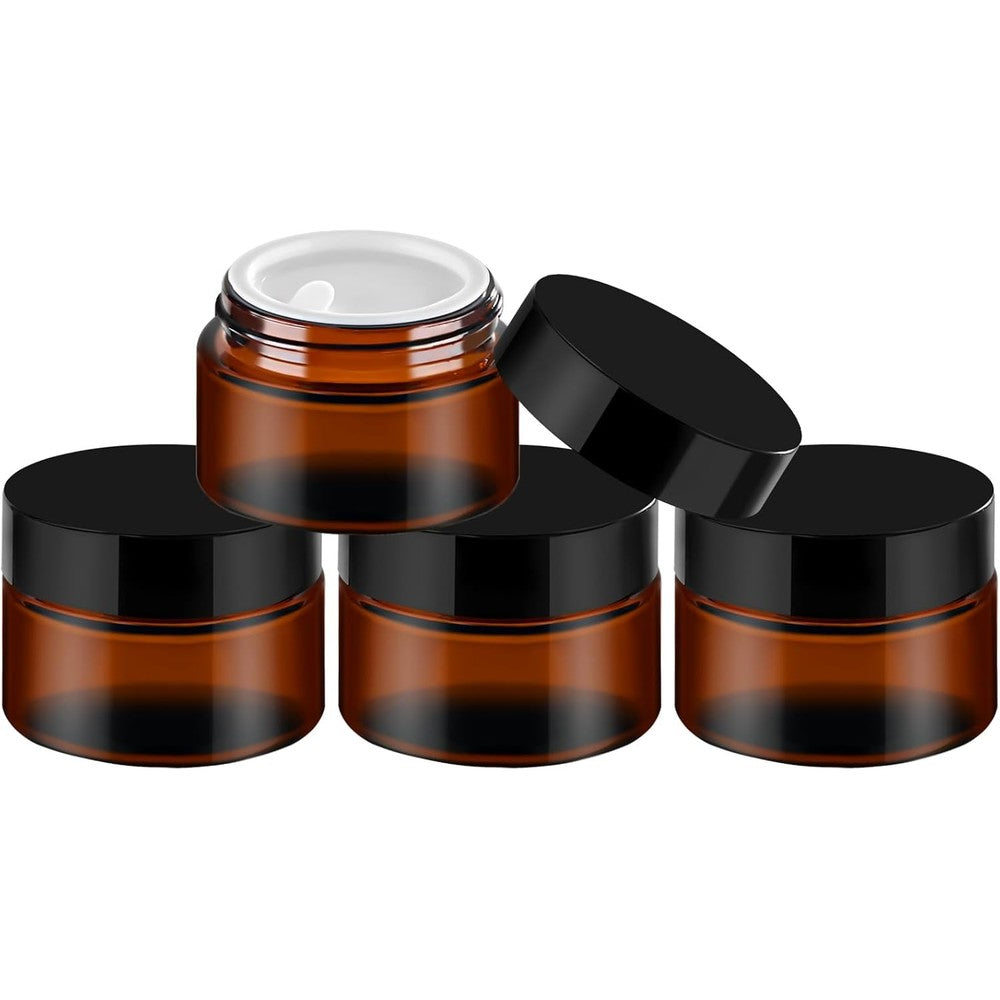 Tuzazo 1 ounce amber glass jars with black lids front view