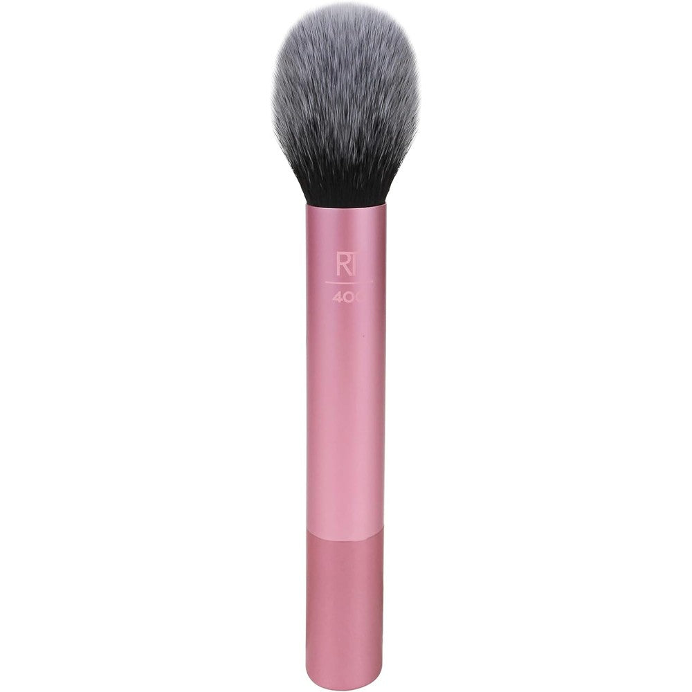 Real Techniques Ultra Plush Blush Makeup Brush front view showcasing the large domed pink synthetic bristles and metallic handle