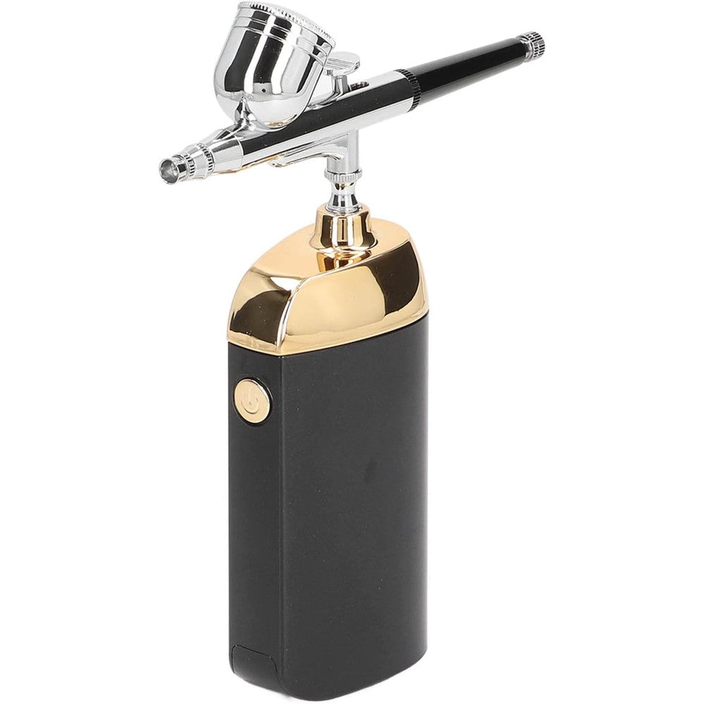 Jectse portable oxygen facial airbrush in matte black and gold finish front view shown with integrated compressor