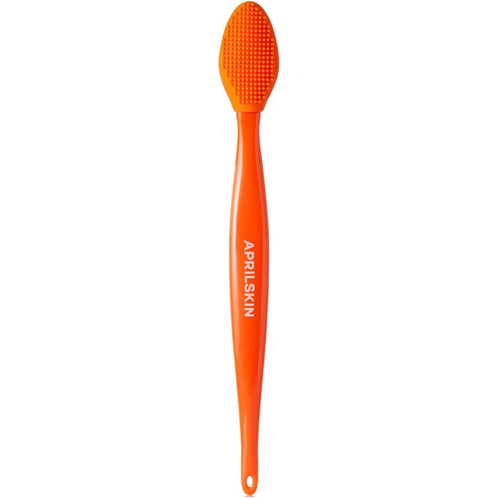 APRILSKIN Pore Cleansing Facial Silicone Brush front view showing orange Sebum Sweeper bristles