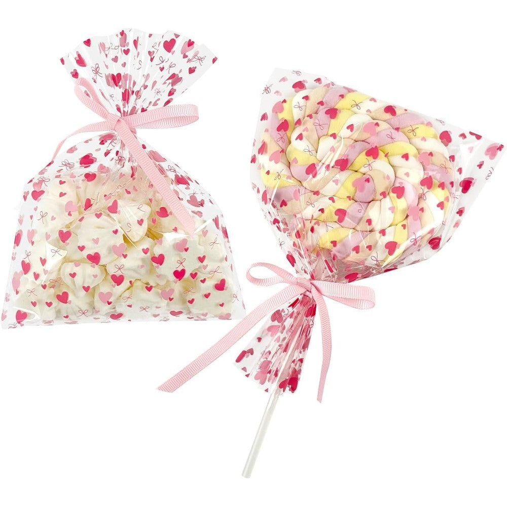 EKAPACKAGING pink heart cellophane treat bags front view filled with festive lollipops.