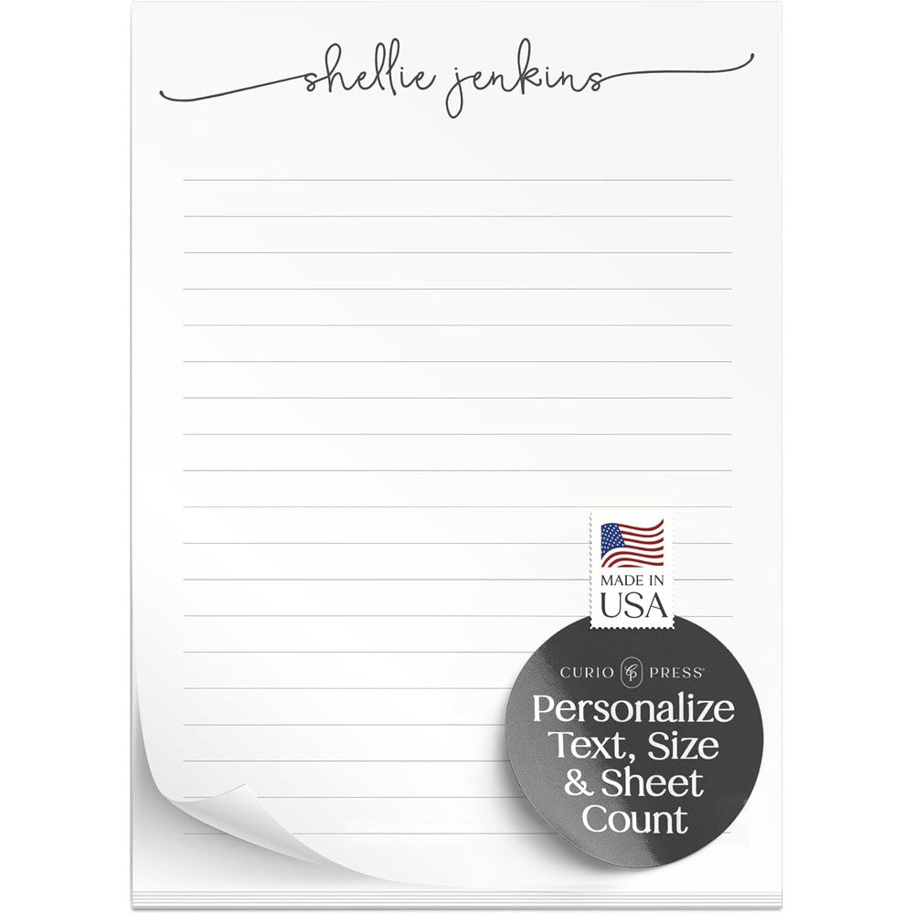 Curio Press personalized script notepad showing clean front view of custom stationery on a desk.