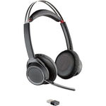 Poly Voyager Focus UC wireless headset front view with charging stand