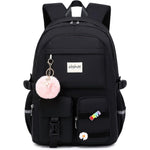 Abshoo Big Student Laptop Backpack front view in black featuring cute pink pom-pom keychain and decorative pins.