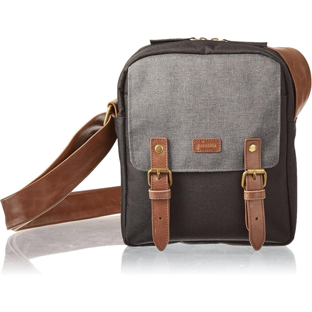 Caseable shoulder travel bag for Kindle in black and grey front view showing leather trim flap