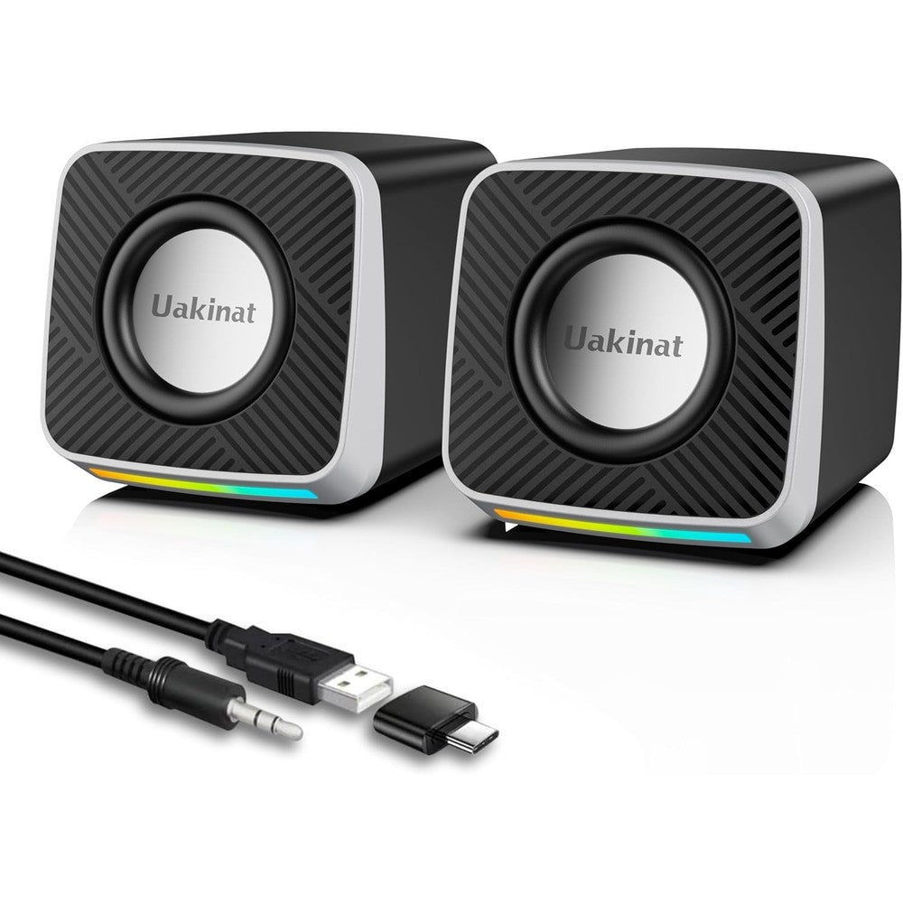 Uakinat carbon fiber computer speakers front view showing black and silver dynamic drivers with built-in LED accent lighting.