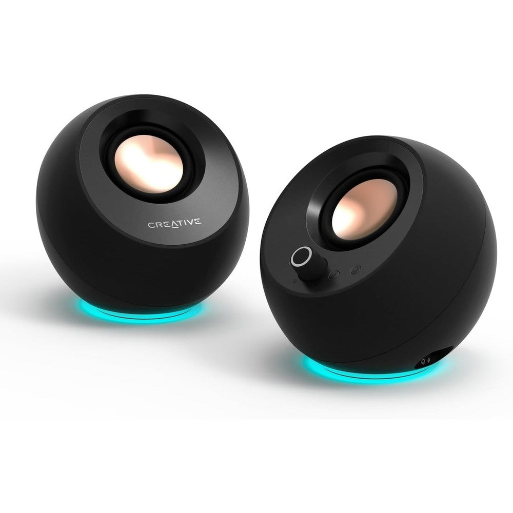 Creative Pebble Pro Black desktop speaker front view displaying the circular design and control knobs.