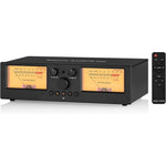 Douk Audio VU3 PRO audio switcher box front view showing dual analog VU meters with warm retro lighting