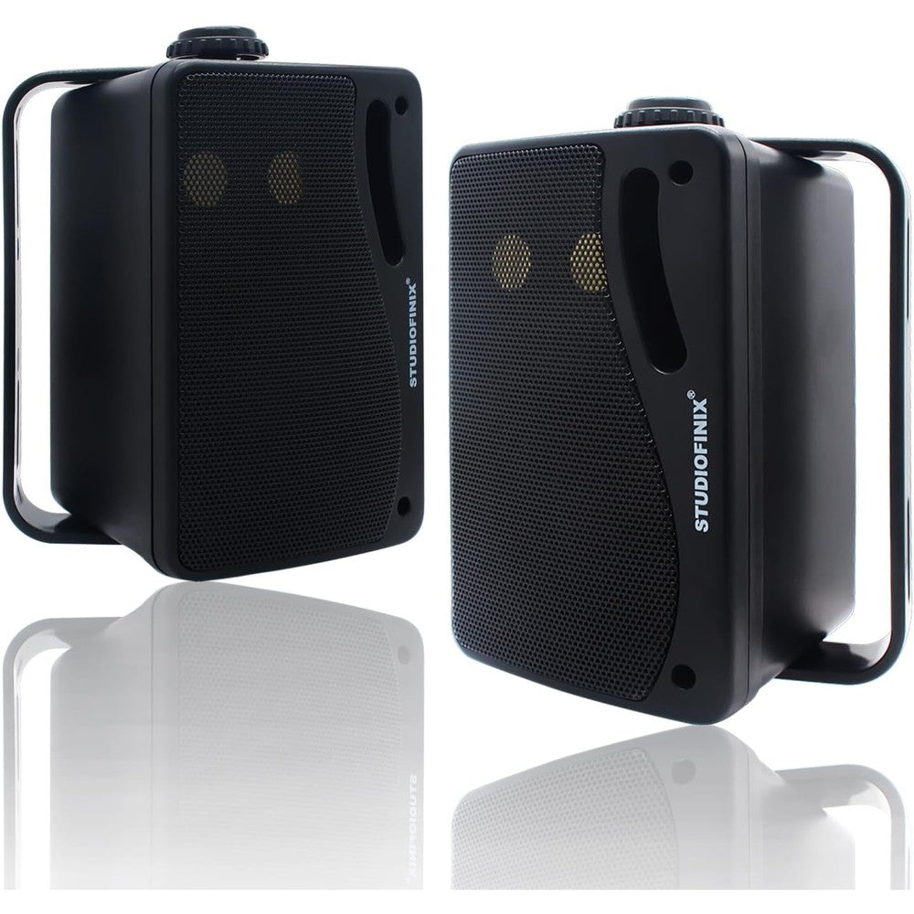 STUDIOFINIX outdoor bluetooth speakers front view mounted on patio wall showing sleek black finish.