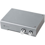 Schiit SYS passive preamp silver front view showcasing the volume knob and source switch.