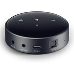 WiiM Mini AirPlay 2 wireless audio streamer front view showcasing sleek black circular design.