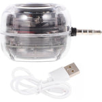Mikikit mini portable speaker front view showcasing transparent housing design and integrated 3.5mm auxiliary jack input