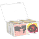 YEXEXINM stackable clear plastic CD organizer front view filled with music discs on a shelf.