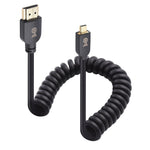 Cable Matters 8K Micro HDMI Coiled Cable front view showcasing the gold plated connectors